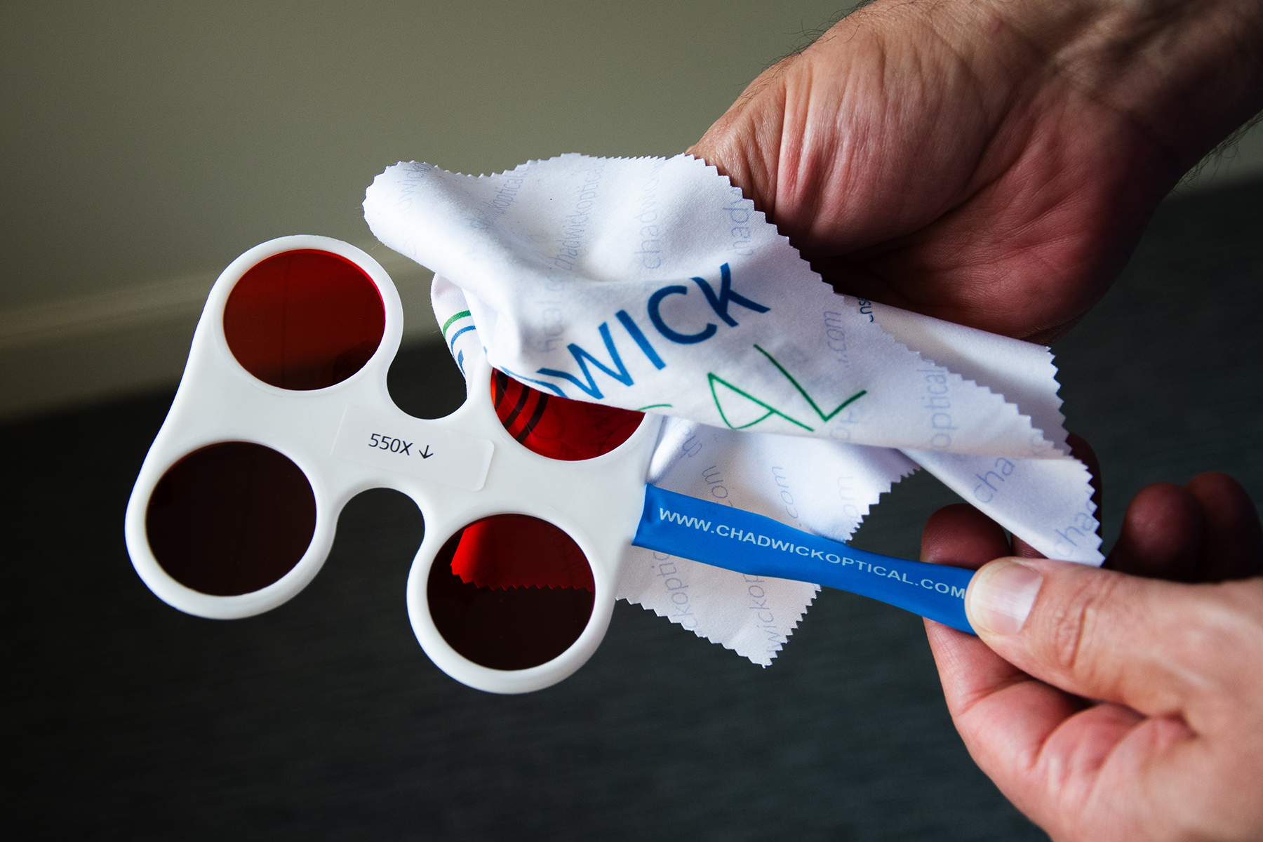 FlipperCleaning_ChadwickOptical_SM Showing how to clean the flipper lenses, with a clean optical cloth.