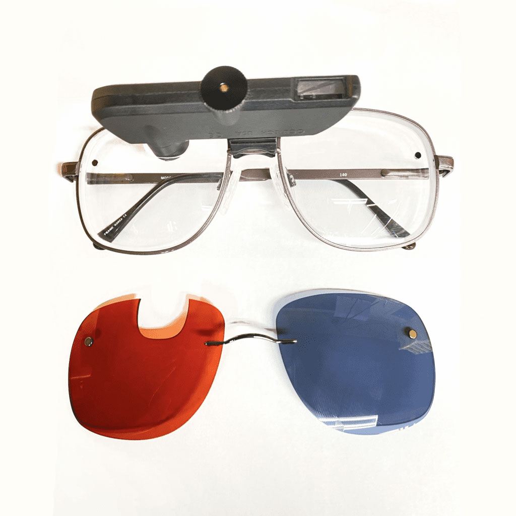 Mounted Digital Loupe on silver glasses with interchangeable dark lenses on chem clip with cutout.