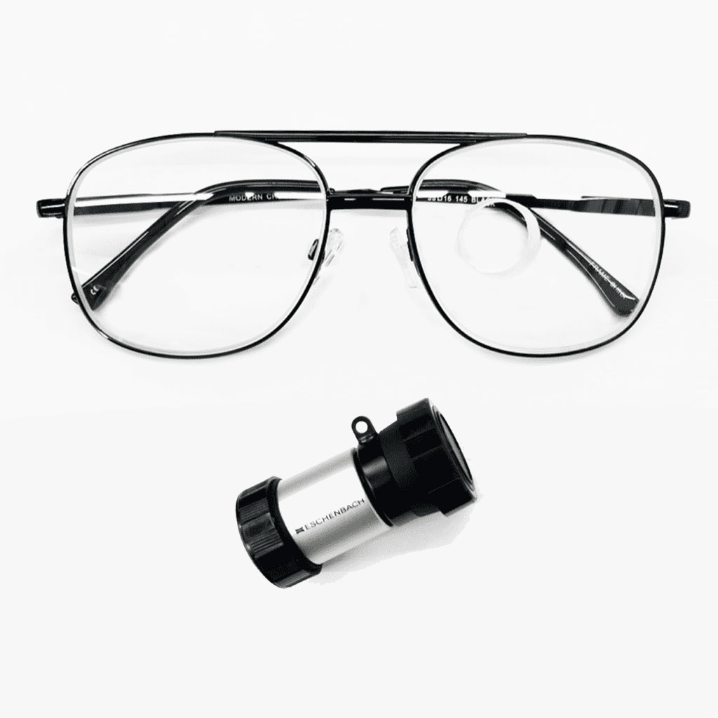 A pair of stylish eyeglasses alongside a small magnifier, showcasing eyewear and optical tools for vision enhancement.