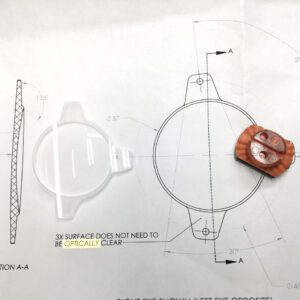 Optical lens with a detailed design diagram showing measurements and specifications for a 3x magnification lens.