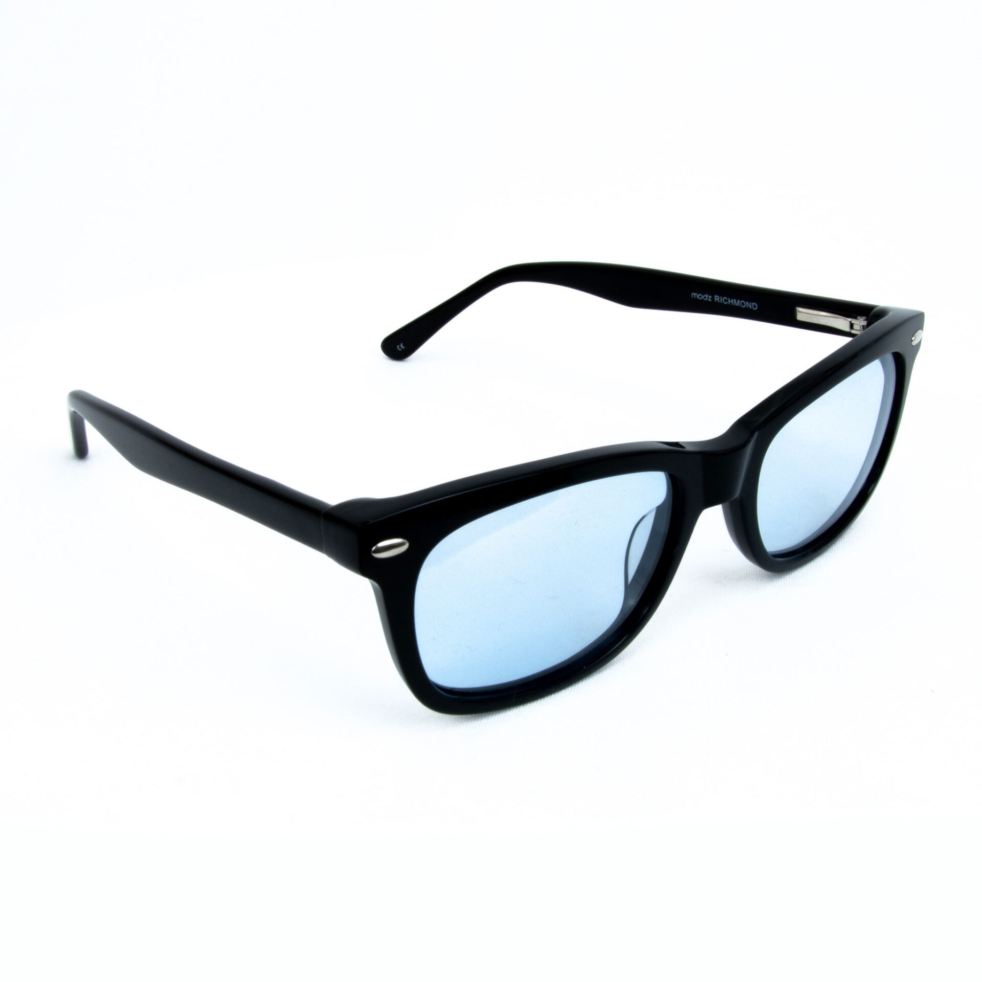 Black sunglasses with blue-tinted lenses, angled on a white background, designed for calming light sensitivity.