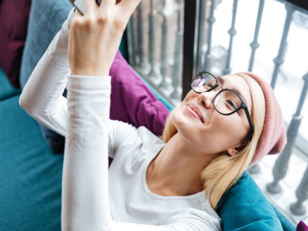 SHAW™ Lenses from Chadwick Optical on a Young Woman looking at a phone
