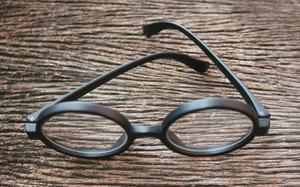 black glasses on old wood