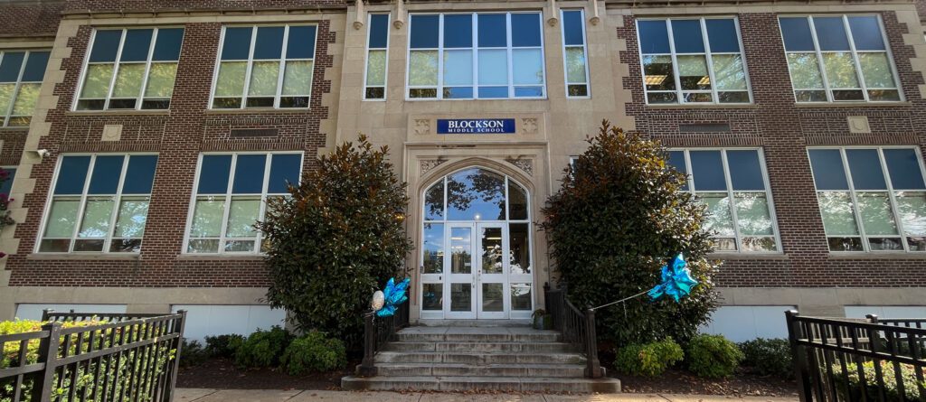 Brick facade of Blockson Middle School with decorative entrance and blue balloons.