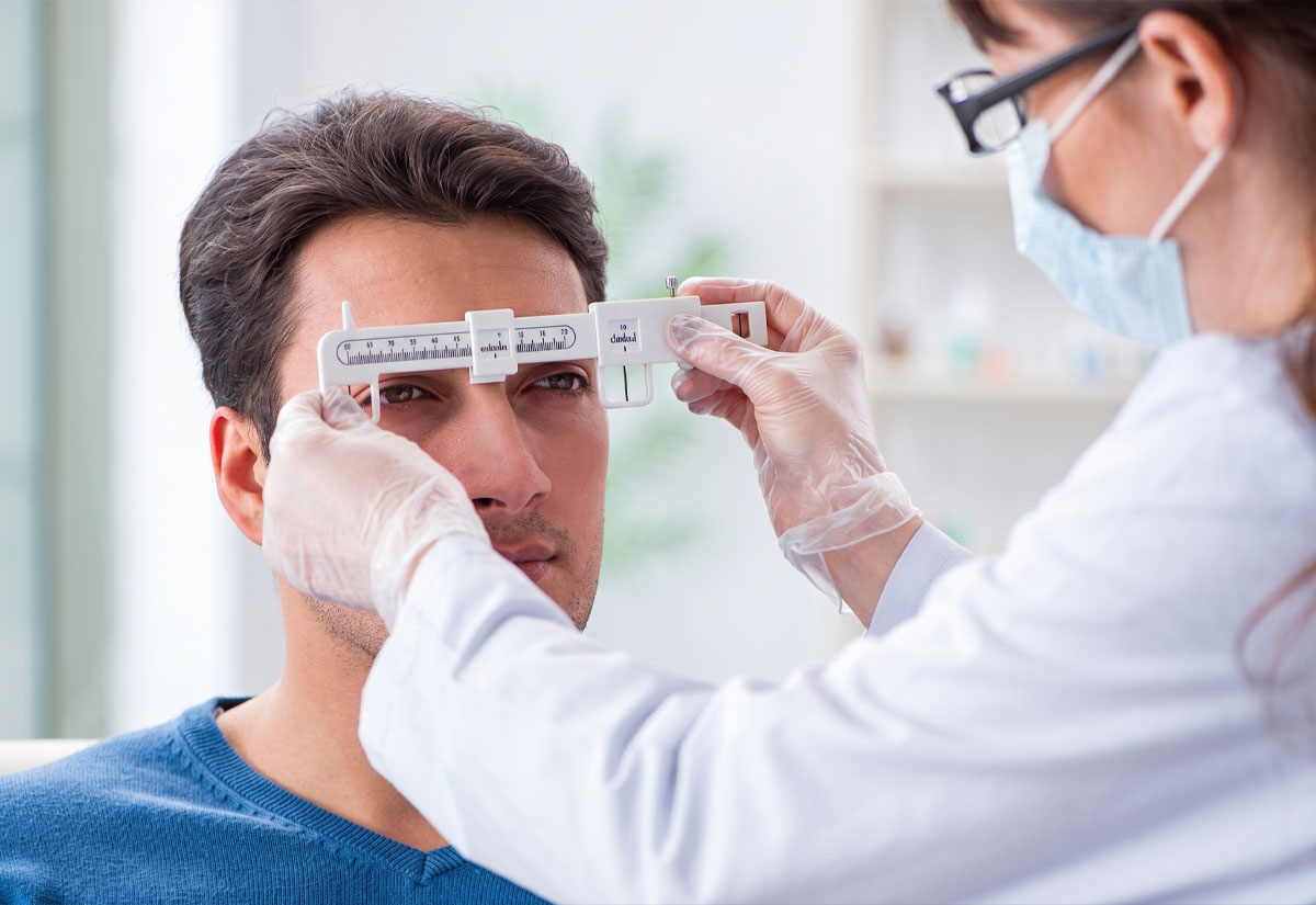 Optician measuring a patient's pupillary distance