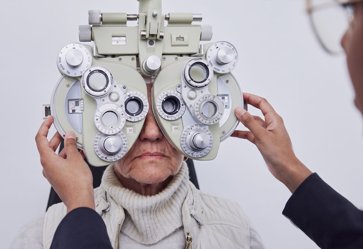 Patient undergoing an eye exam with a phoropter