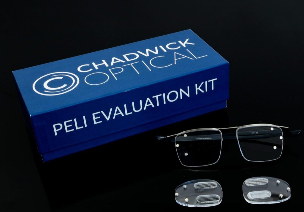 peli evaluation kit Chadwick Optical Peli Evaluation Kit box with glasses and specialized prism lenses, displayed on a black surface.